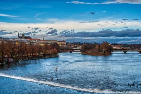 View of Vltava river with Charles bridge and cathedral in Prague Stock Photos