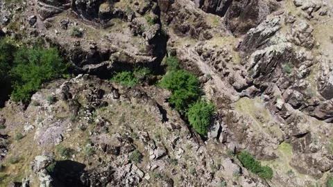 View of volcanic rock texture and deep canyon crevices in Kazakhstan Stock Footage 338095452