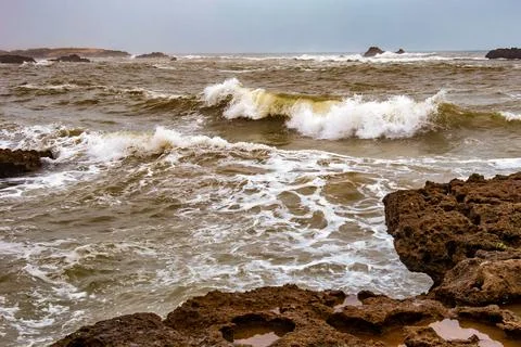 View of the volcanic shore of the Atlantic Ocean in the area of Essaouira i.. Stock Photos