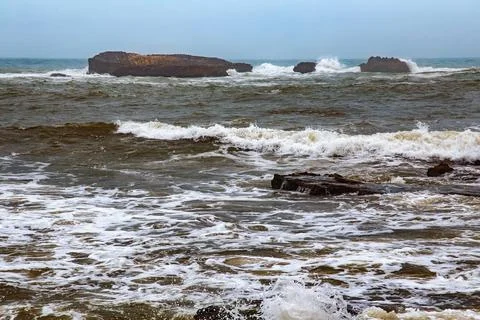 View of the volcanic shore of the Atlantic Ocean in the area of Essaouira i.. Stock Photos