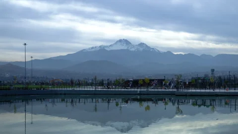 View of the Volcano Reflected in the Lake Timelapse Sky Stock Footage 255678425