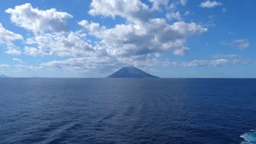 View of a Volcano sorrounded by the sea Stock Footage 86114107