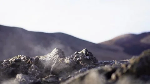 A view of a volcano that is still active and a view of solidified lava Stock Footage 258262410