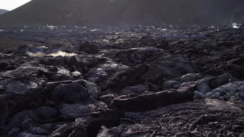 A view of a volcano that is still active and a view of solidified lava Stock Footage 258262444