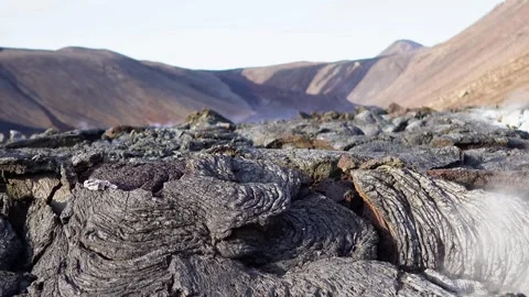 A view of a volcano that is still active and a view of solidified lava Stock Footage 258262482
