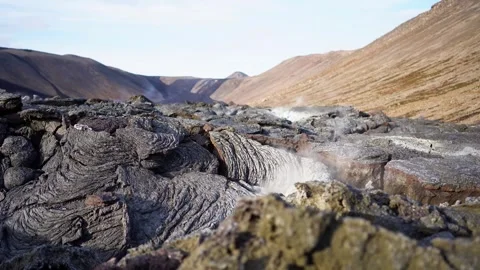 A view of a volcano that is still active and a view of solidified lava Stock Footage 258262522