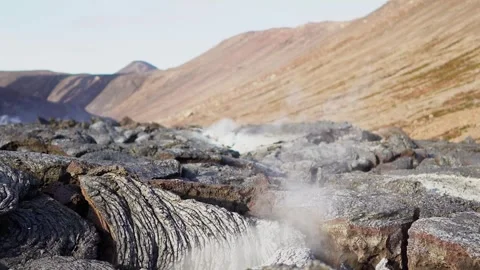 A view of a volcano that is still active and a view of solidified lava Stock Footage 258262563