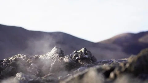 A view of a volcano that is still active and a view of solidified lava Stock Footage 262069787