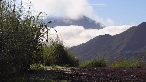 View of volcanoes in the clouds at dawn. Bali, Indonesia Stock Footage 126580471
