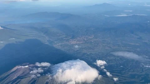A view of volcanoes from the plane window Stock Footage 279705806