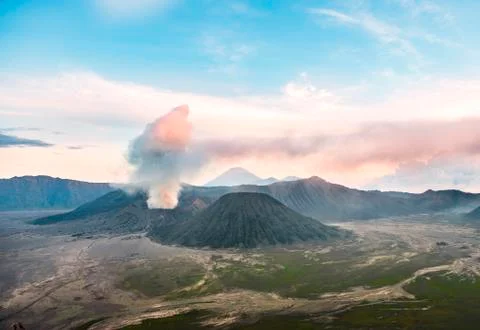 View of volcanoes at sunset smoking volcano Gunung Bromo Batok Mt Kursi Gunung Photos