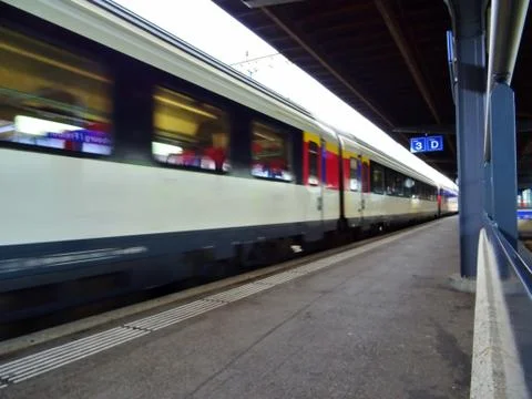 View of wagons of a train that arrives at the train station Stock Photos