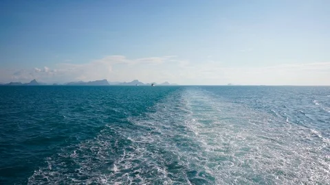 View of the wake trail behind a large ship at sea. Sea landscape at sunny Stock Footage 88363545