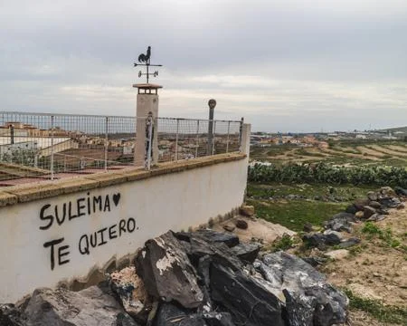 View to the wall with Spanish text graffity Stock Photos