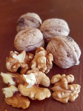 A view of the walnut with and without its shell Stock Photos