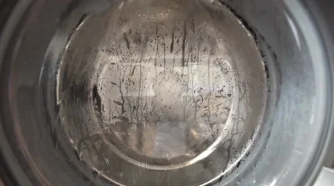 View of a washing machine drum during wash Video stock 64767626