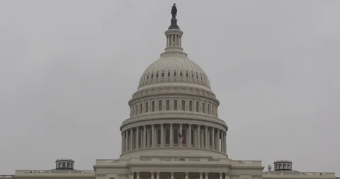 View of Washington D.C. Us Capitol Hill Government Building Symbol Flag Waving Stock Footage 98089792