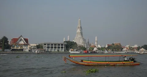 View of Wat Arun Temple Long Tail Boat Passing on Chao Phraya River Bangkok City Stock Footage 95679289