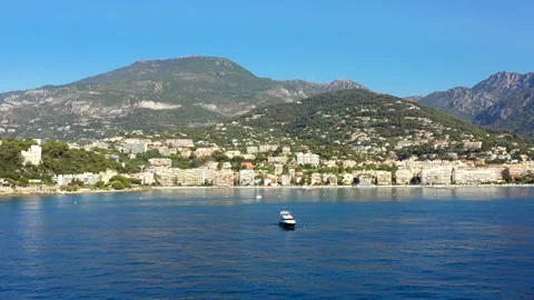 View from the water to the city of Mentom, Yacht in the background of the city. Stock Footage 220798564