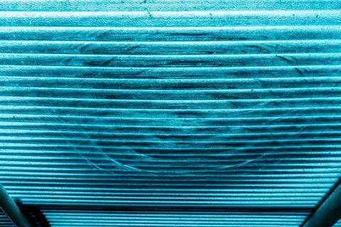 View of water drop on translucent or teal blue corrugated plastic roofing s.. Stock Photos