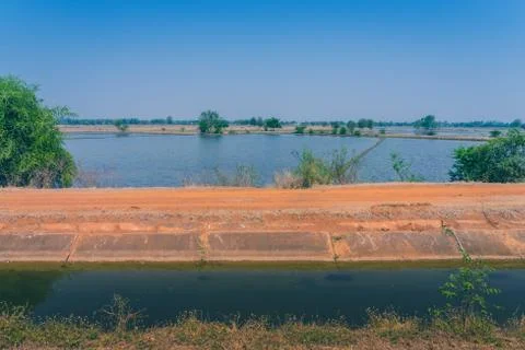 View of Water management in the rice fields from the irrigation canal before  Stock Photos