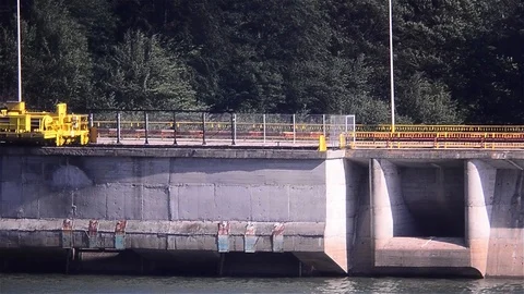 View of a water storage dam. On both sides of the water, you can see the fore Video stock 91904174