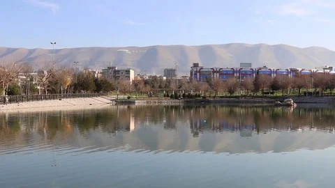 A view of water stream with mountains in the background Stock Footage 127385425