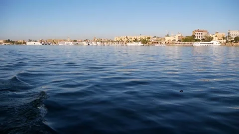 View Of The Water Surface From A Motorboat Sailing On A River In A Small Town Stock Footage 226963404