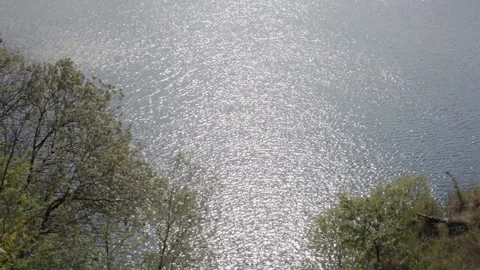 View of the water surface of a mountain lake in sunny weather. Background. Stock Footage 112633580