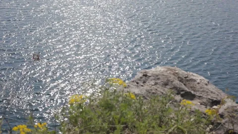 View of the water surface of a mountain lake in sunny weather. Background. Stock Footage 112633694