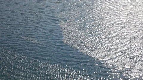 View of the water surface of a mountain lake in sunny weather. Background. Stock-Footage 112640679