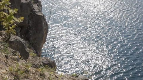 View of the water surface of a mountain lake in sunny weather. Background. Stock-Footage 112640760