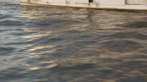 View of water surface while travelling down city river on ferry boat Stock Footage 120925755