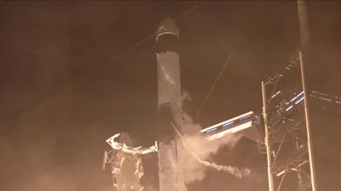 View from water tower of SpaceX Dragon Crew-8 mission spacecraft launch Stock Footage 289728821