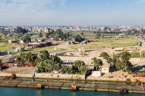 View from the water on the west side of the Suez Canal Stock Photos