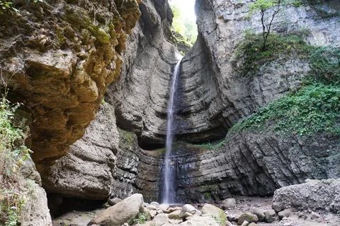 View of a waterfall from cliff in Chegem Gorge Stock Photos