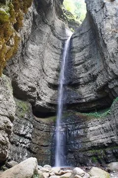 View of a waterfall from a cliff in a gorge Stock Photos