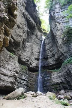 View of a waterfall from a cliff Stock Photos