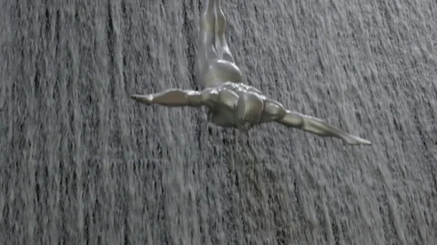 View of Waterfall at Dubai Mall with Diving Statues Stock Footage 108427793