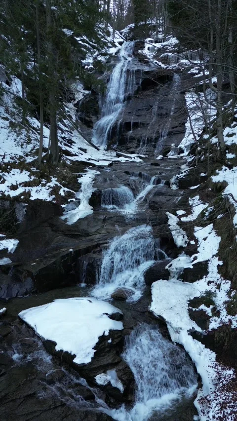 View of a waterfall during winter. Cold and frost in the forest Stock Footage 264503574