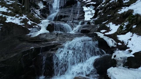 View of a waterfall during winter. Cold and frost in the forest. Stock Footage 266829589
