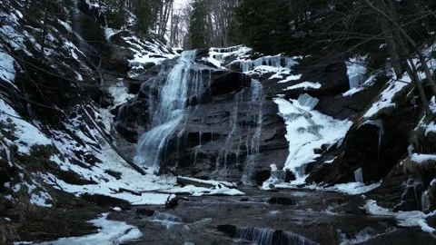 View of a waterfall during winter. Cold and frost in the forest Stock Footage 266829700