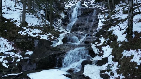 View of a waterfall during winter. Cold and frost in the forest. Stock Footage 271359838