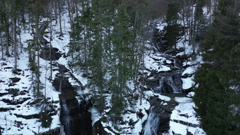View of a waterfall during winter. Cold and frost in the forest Stock Footage 275029434