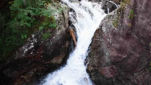 View of waterfall in forest mountains summer time Stock Footage 133695723