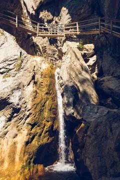 View at waterfall path along mountain stream. Tourist spot. Travel destinatio Stock Photos