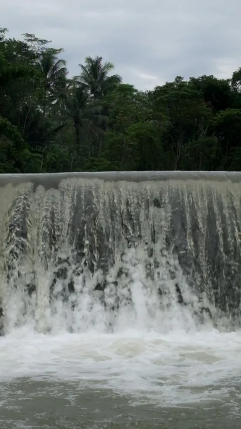 View of a waterfall at a river dam Stock Footage 297732014