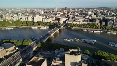 View of Waterloo Bridge spanning the River Thames in London Stock Footage 261347462