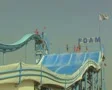 View of waterslide with people going down it SD Footage