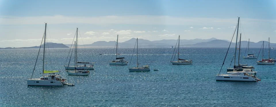 View of watersport, sailboats and Fuerteventura in background, Playa Blanca, Stock Photos